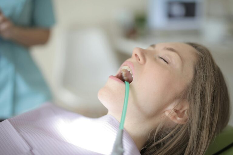 A young woman undergoing a dental checkup, showcasing healthcare and oral hygiene.